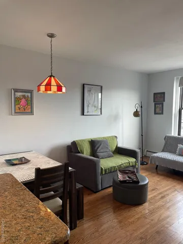 a living room with furniture and a table