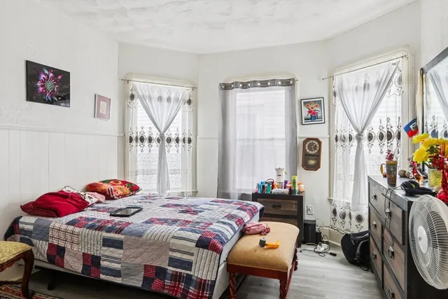 a bedroom with a bed and a dresser