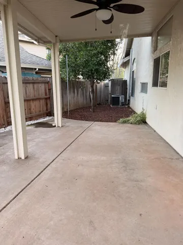 a view of a porch with wooden floor