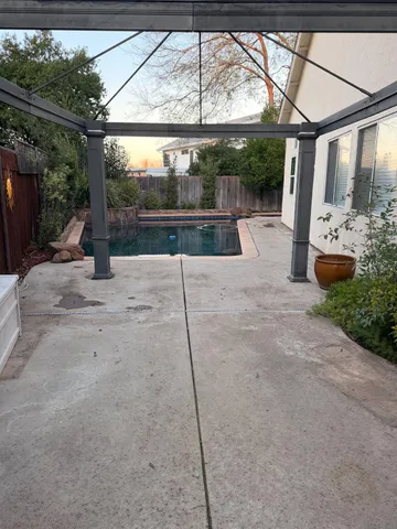 a view of yard with a car parked