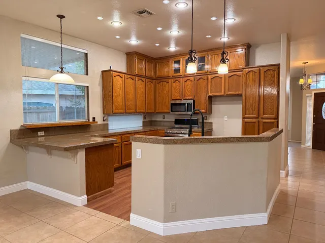 a kitchen with counter top space cabinets and stainless steel appliances