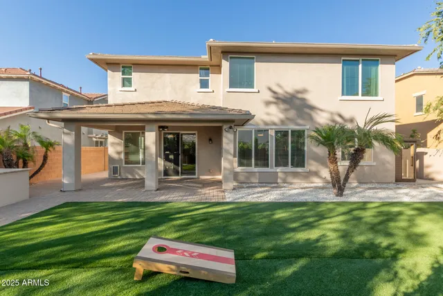 a view of swimming pool with a backyard and seating area