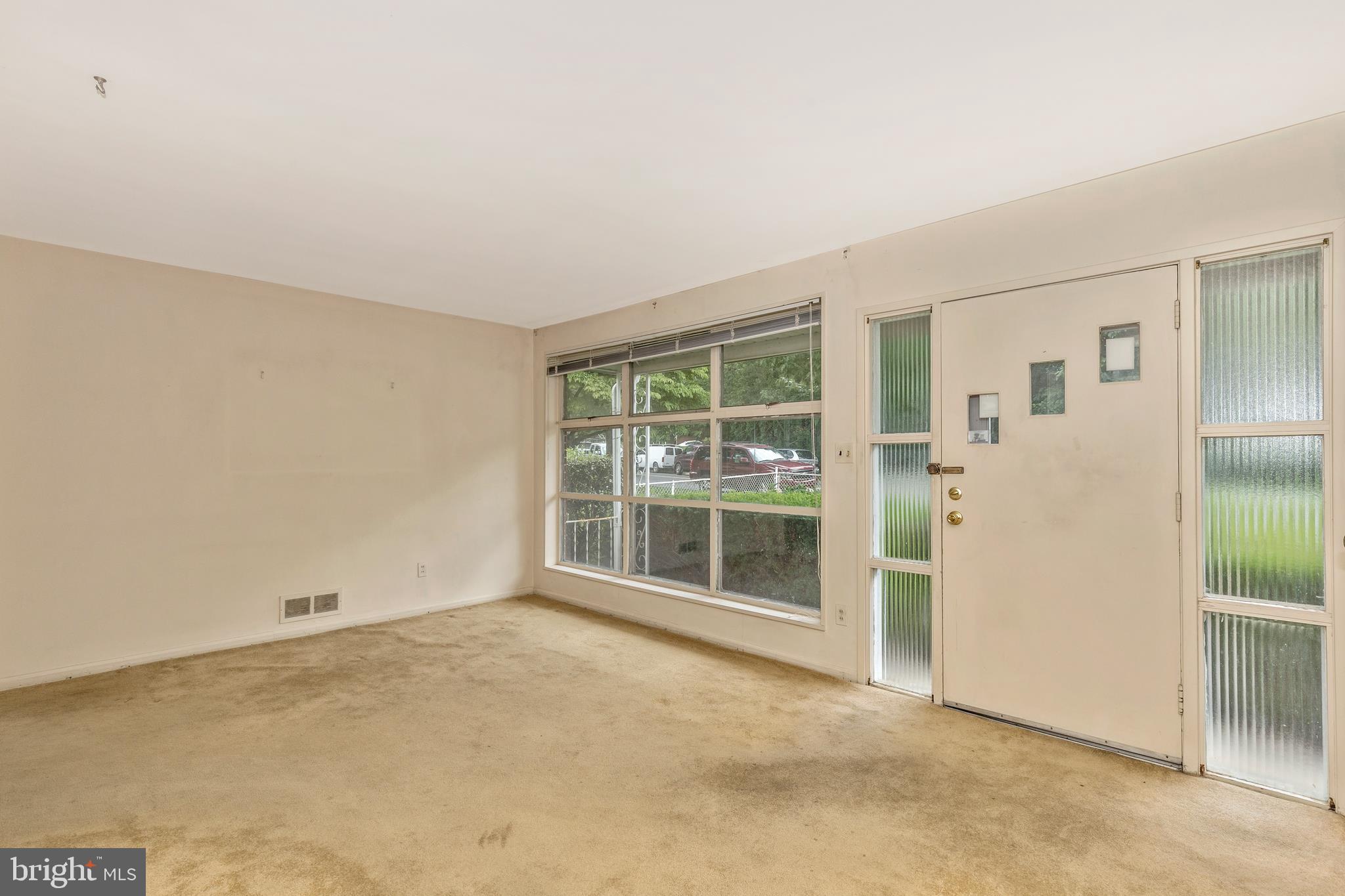 3929 Weller Road Silver Spring, MD 20906 - Photo 5 of 54 an empty room with entrance and door