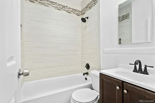 a bathroom with a sink a toilet and a bathtub