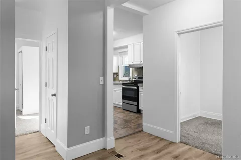 a view of an empty room with windows