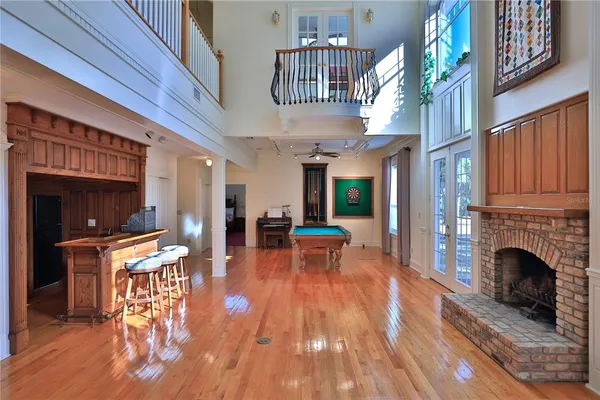 a kitchen with stainless steel appliances granite countertop a sink a stove and a refrigerator