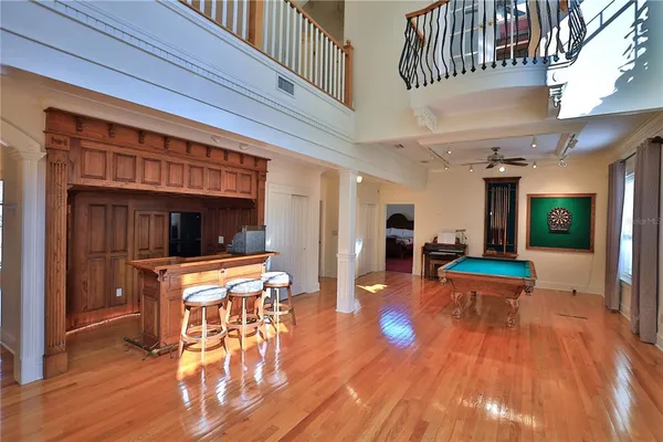 a kitchen with granite countertop a sink a counter top space cabinets stainless steel appliances and a counter top space