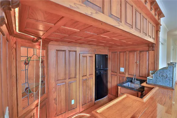 a bedroom with a bed dresser and a window