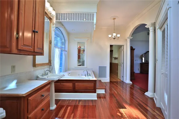 a bathroom with a sink mirror and vanity