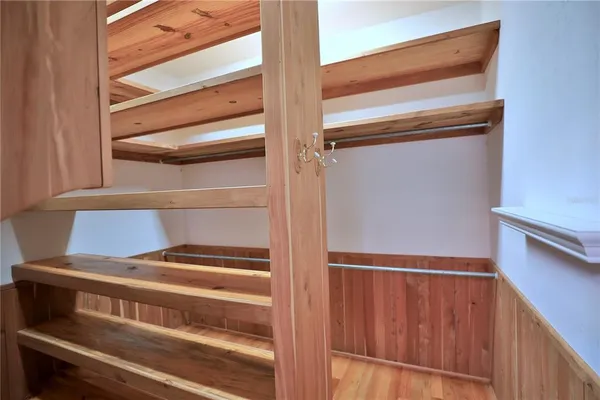 a spacious bathroom with a double vanity sink and a mirror