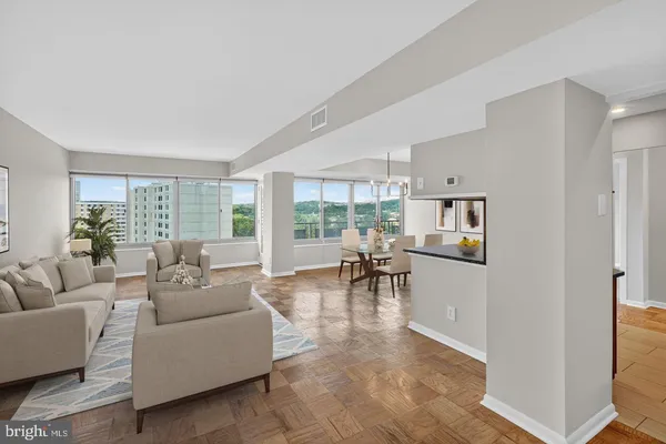 a living room with furniture and a large window