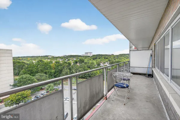 a view of balcony with furniture