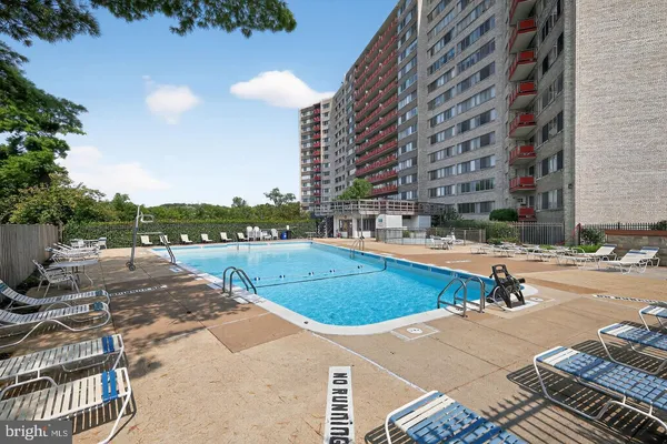 a view of a swimming pool with a lounge chairs
