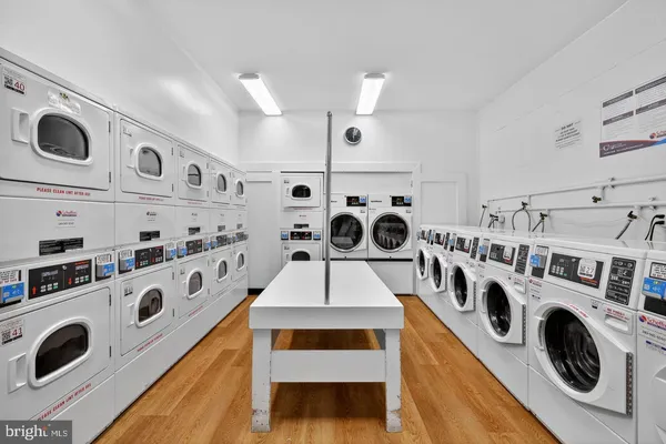 a kitchen with stainless steel appliances a white stove top oven and a refrigerator