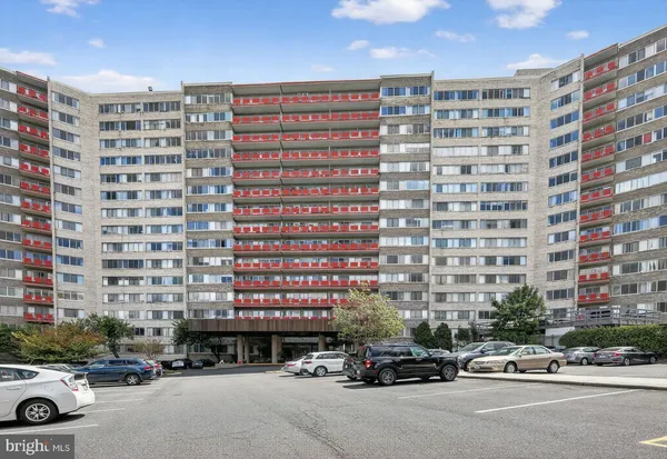 a city street filled with lots of cars and buildings