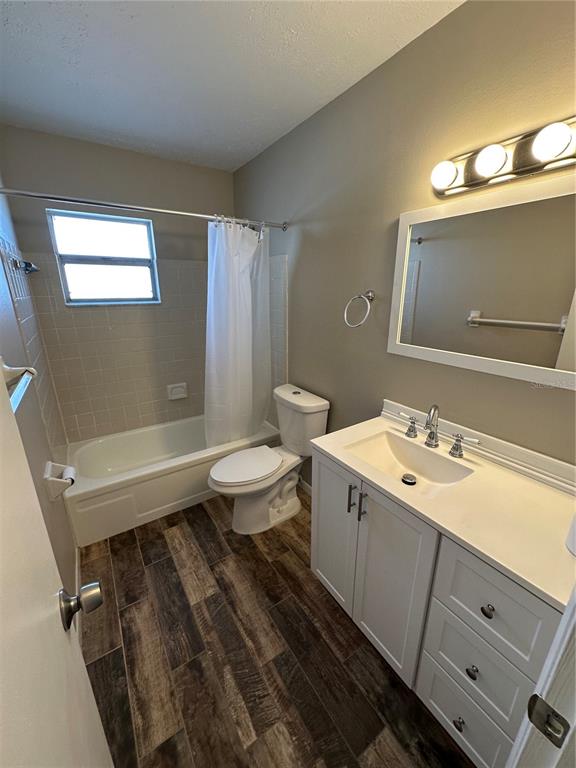 1025 Apollo Beach Boulevard, Unit D Apollo Beach, FL 33572 - Photo 4 of 8 a bathroom with a sink mirror vanity and toilet