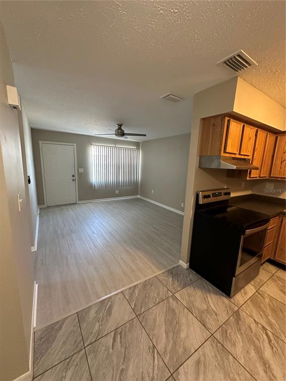 1025 Apollo Beach Boulevard, Unit D Apollo Beach, FL 33572 - Photo 5 of 8 a view of a livingroom with wooden floor