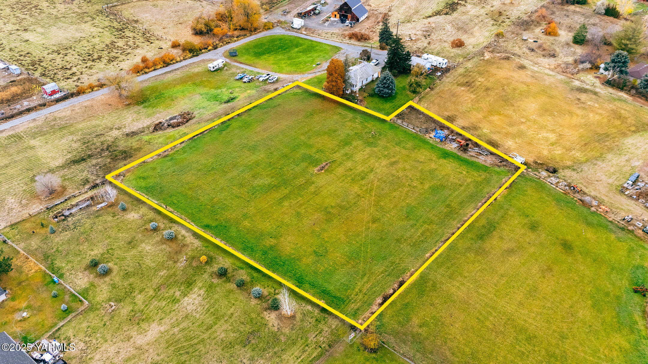 Nka Collins Road Selah, WA 98942 - Photo 6 of 7 a blue swimming pool with lawn chairs and plants