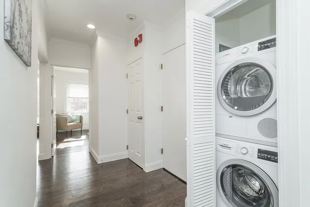 a view of an empty room and a window