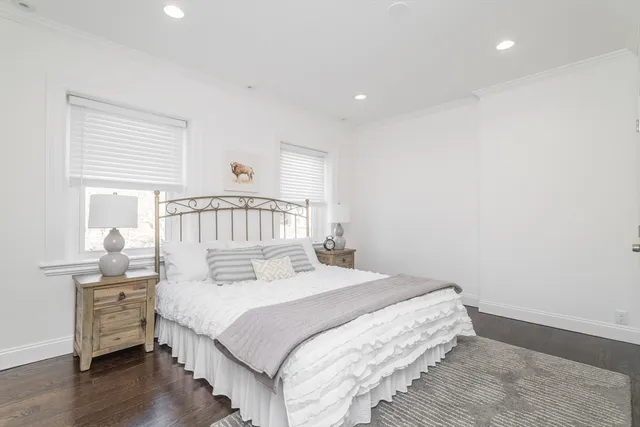 a bathroom with a sink mirror and toilet