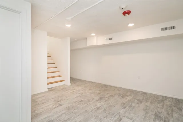 a view of an empty room with stairs
