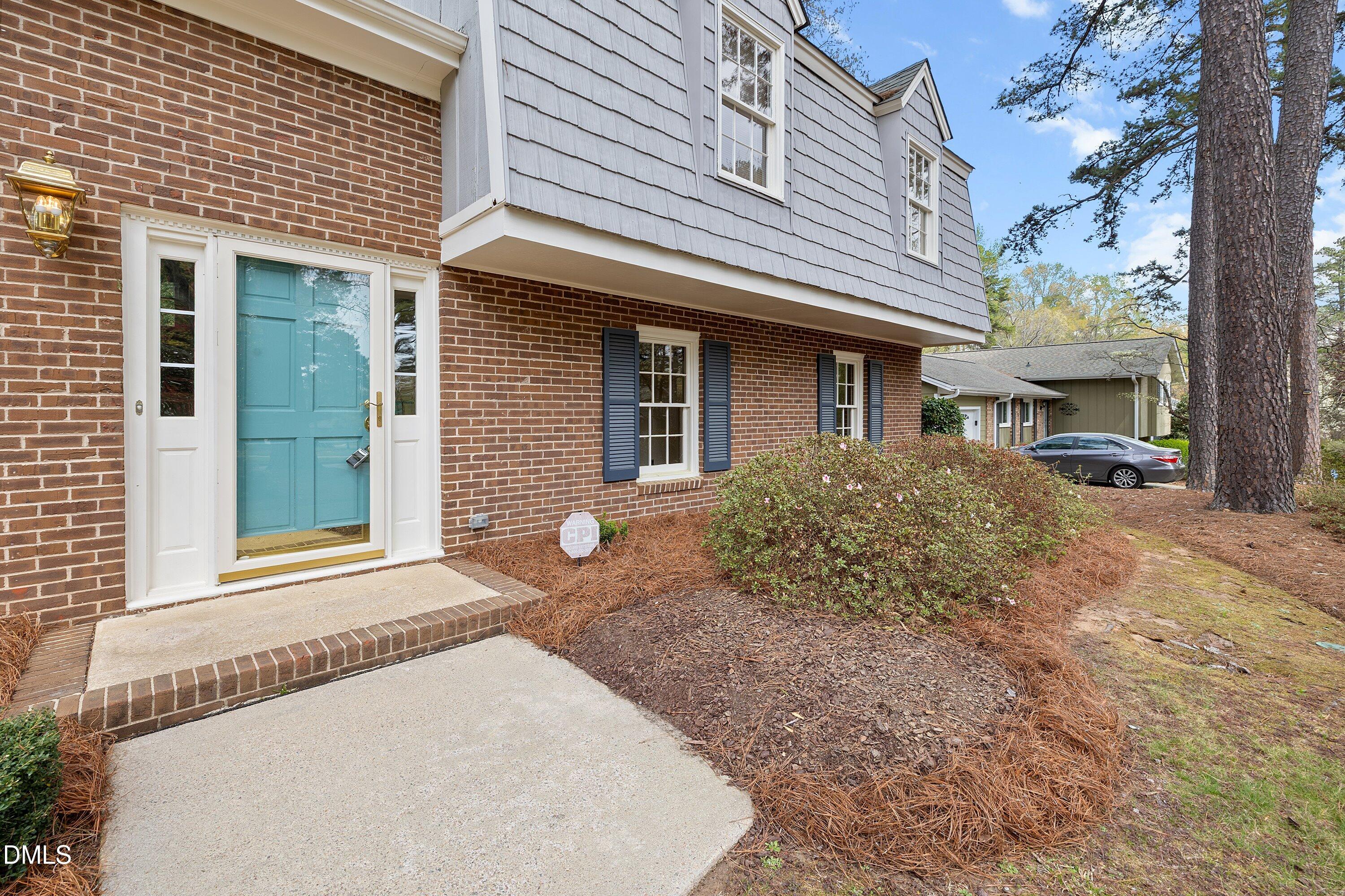 1429 Falls Church Road Raleigh, NC 27609 - Photo 12 of 60 a front view of a house with a yard