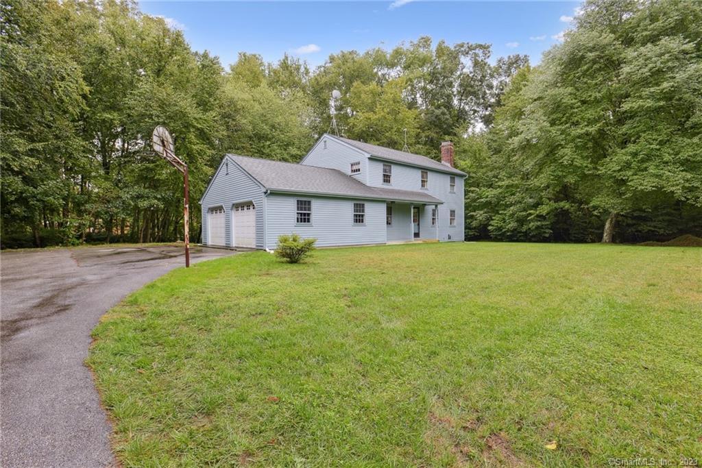 1718 Center Groton Road Ledyard, CT 06339 - Photo 1 of 1 a house view with a garden space