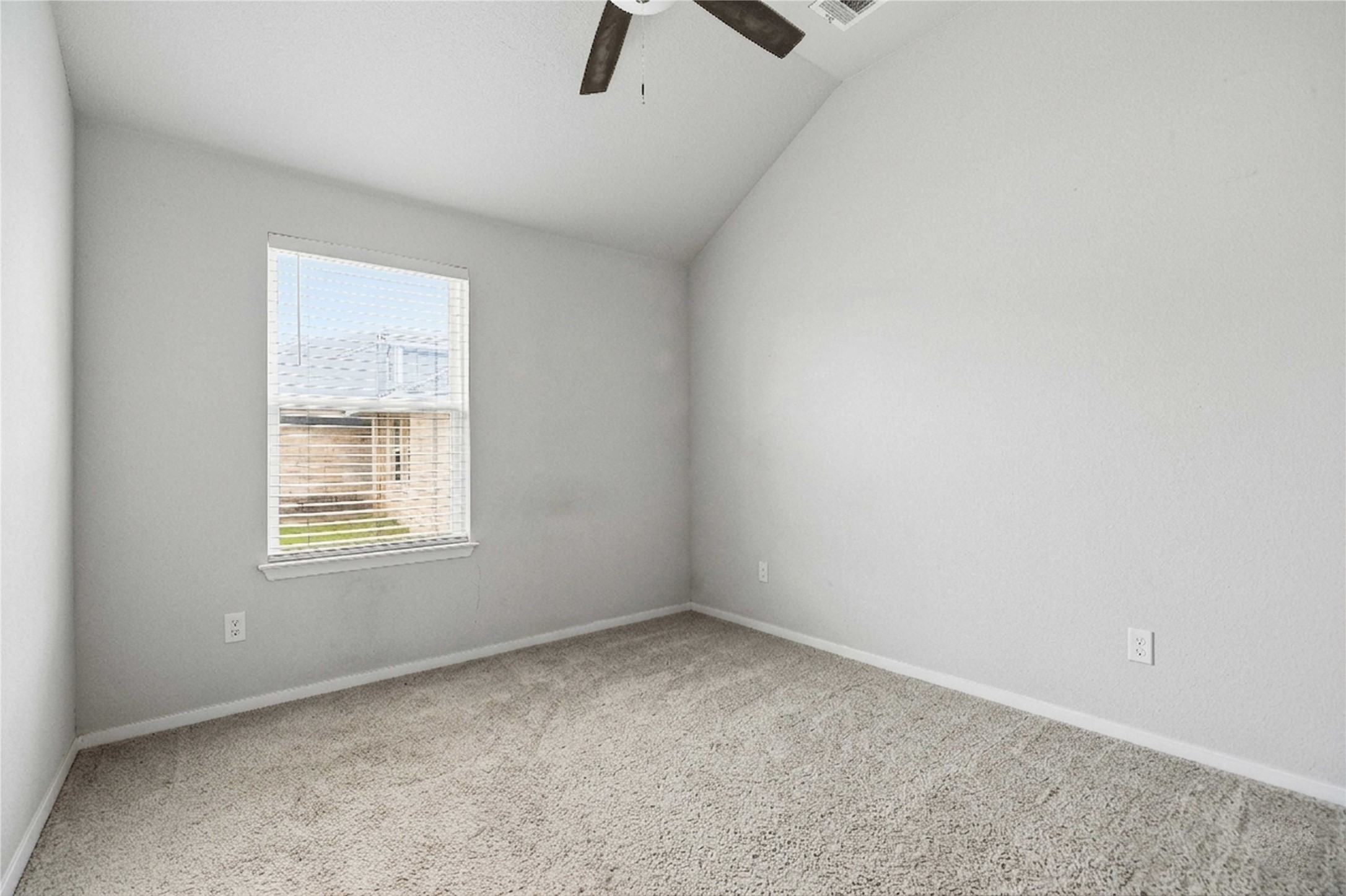 107 Saranac Drive Elgin, TX 78621 - Photo 11 of 17 an empty room with a window and a ceiling fan