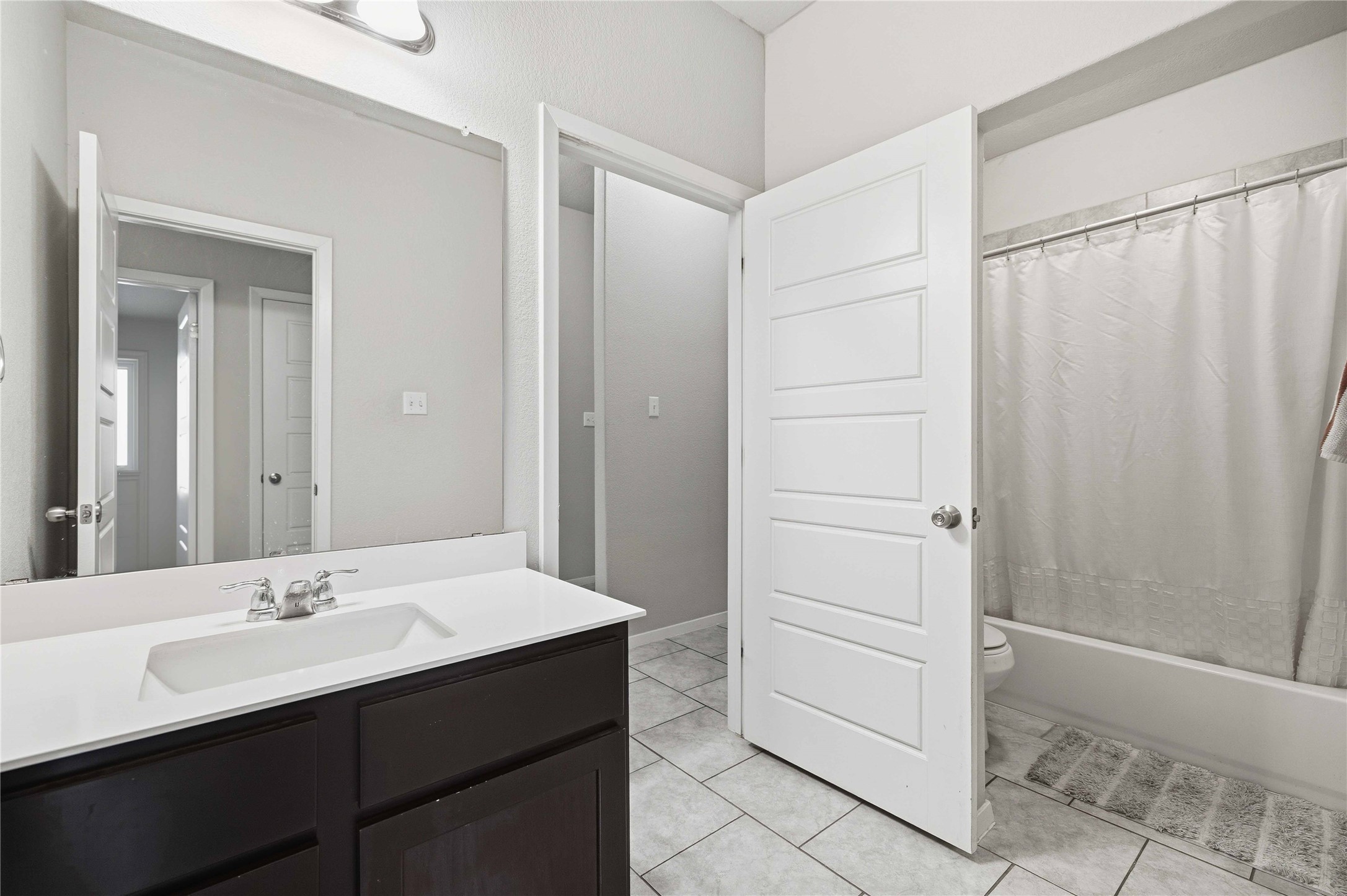 107 Saranac Drive Elgin, TX 78621 - Photo 12 of 17 a bathroom with a sink and a mirror