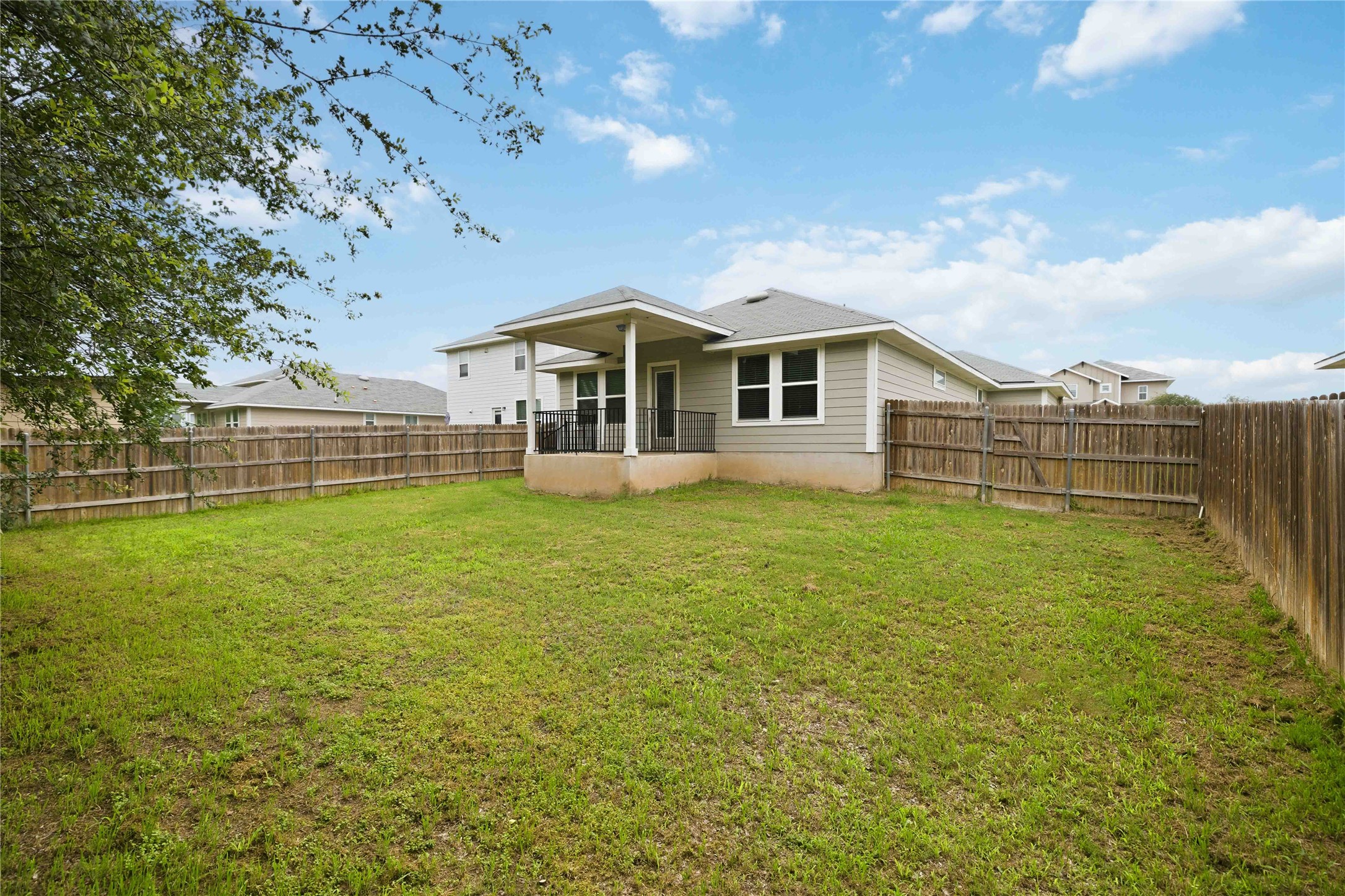 107 Saranac Drive Elgin, TX 78621 - Photo 15 of 17 a view of a house with a backyard