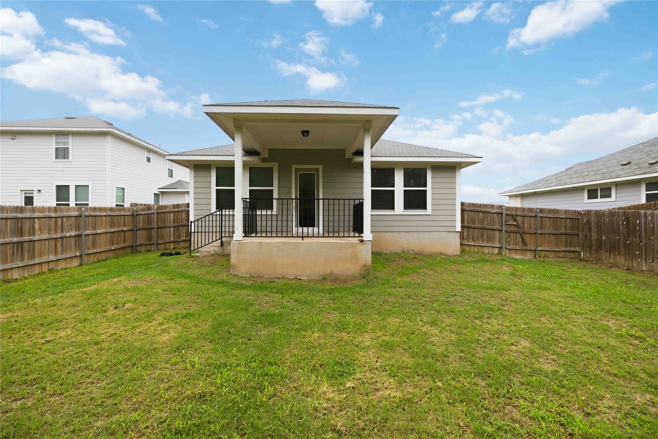 107 Saranac Drive Elgin, TX 78621 - Photo 17 of 17 a view of a house with a backyard