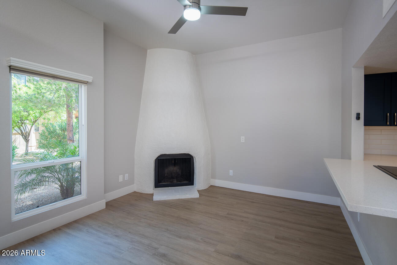 4540 North 44th Street, Unit 50 Phoenix, AZ 85018 - Photo 3 of 31 wooden floor in an empty room with a window