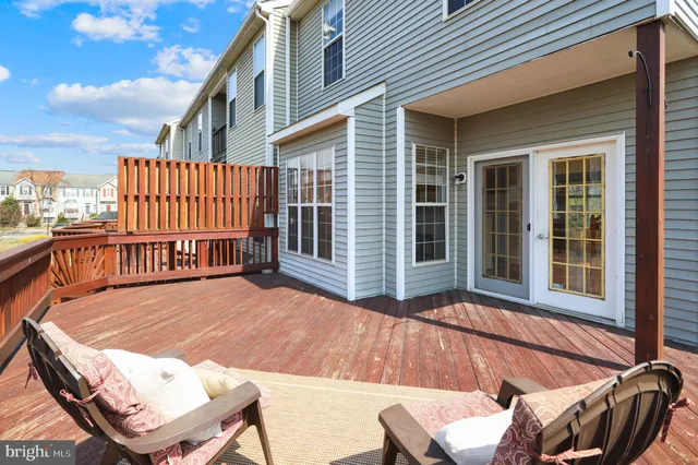 a balcony with table and chairs