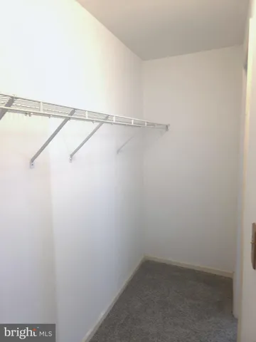 a view of an empty room and closet