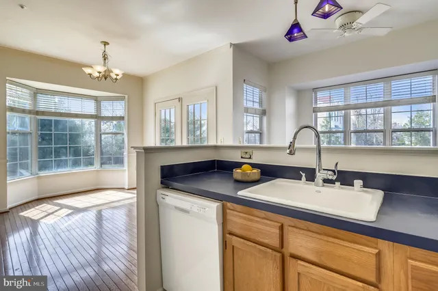 a kitchen with a sink and a window