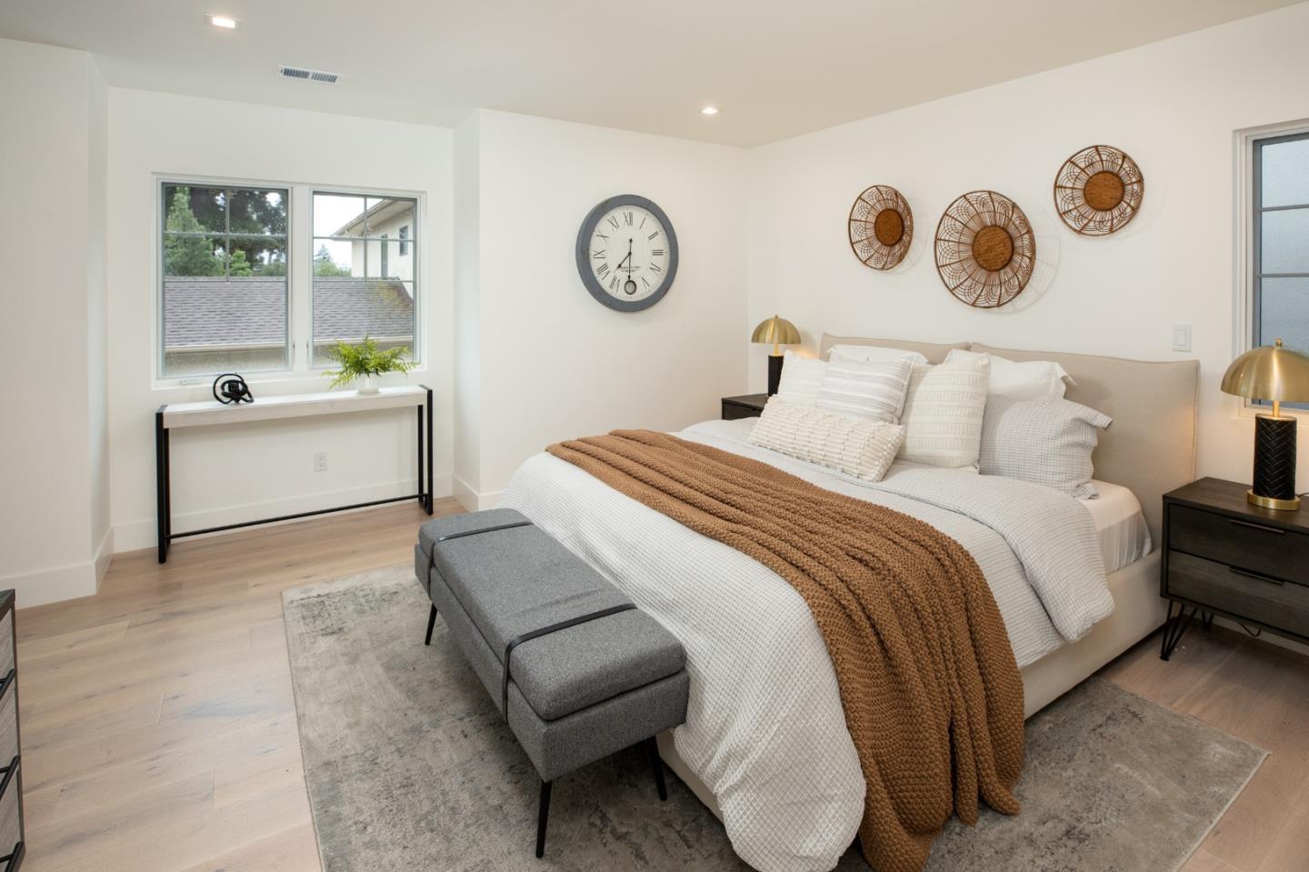 735-737 Linden Avenue Burlingame, CA 94010 - Photo 16 of 42 a spacious bedroom with a bed and a table in it
