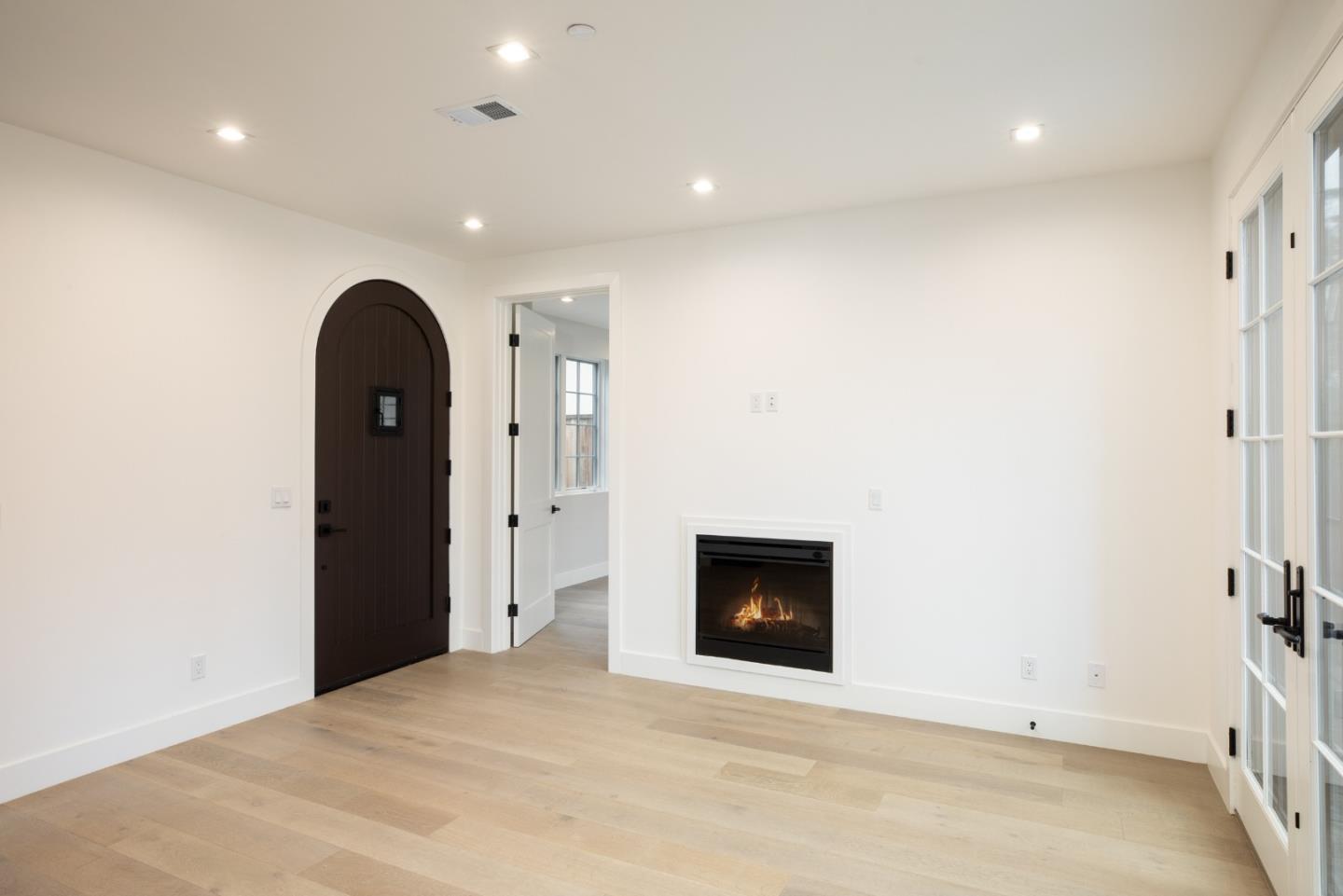 735-737 Linden Avenue Burlingame, CA 94010 - Photo 25 of 42 a view of an empty room with a fireplace