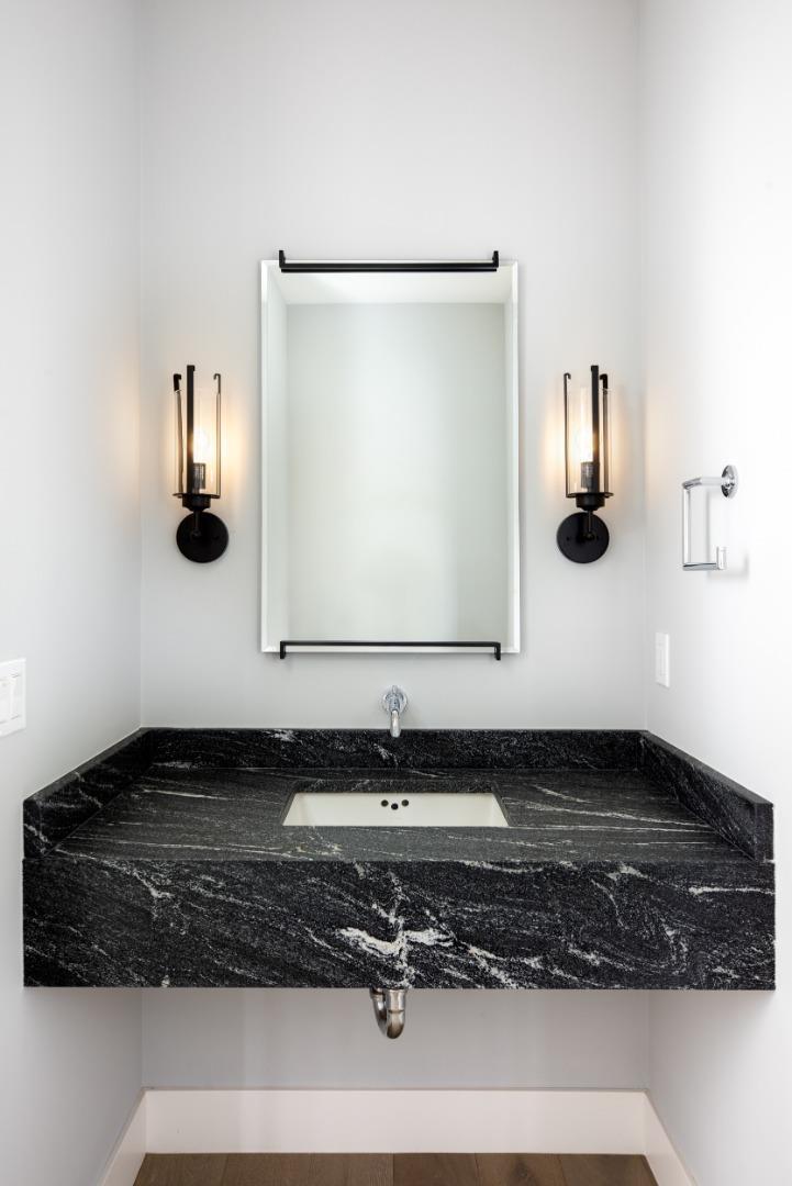 735-737 Linden Avenue Burlingame, CA 94010 - Photo 32 of 42 a bathroom with a sink and mirror