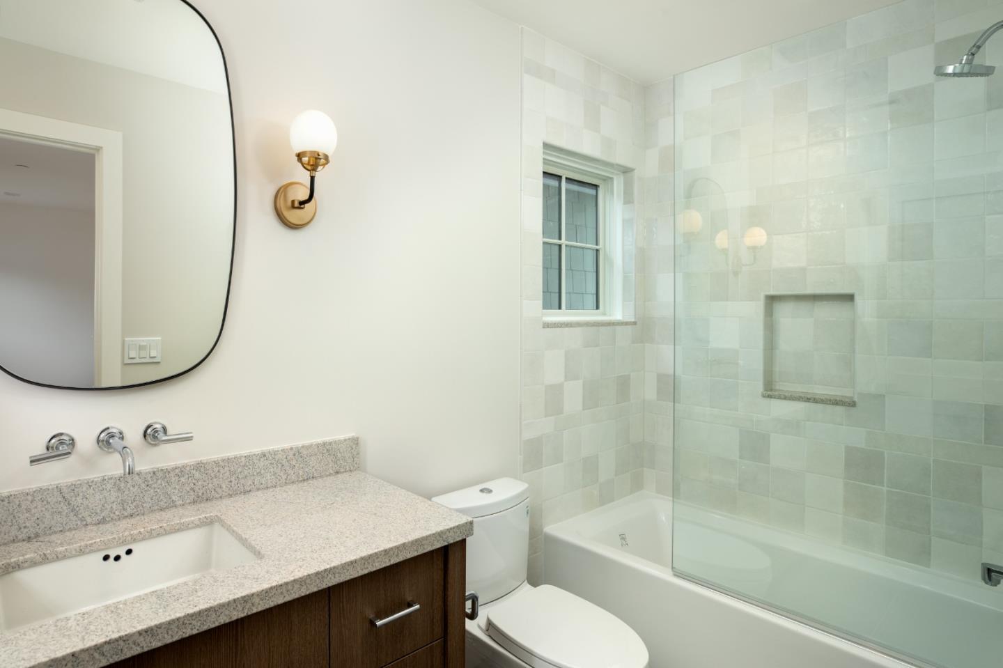735-737 Linden Avenue Burlingame, CA 94010 - Photo 36 of 42 a bathroom with a sink toilet a mirror and shower