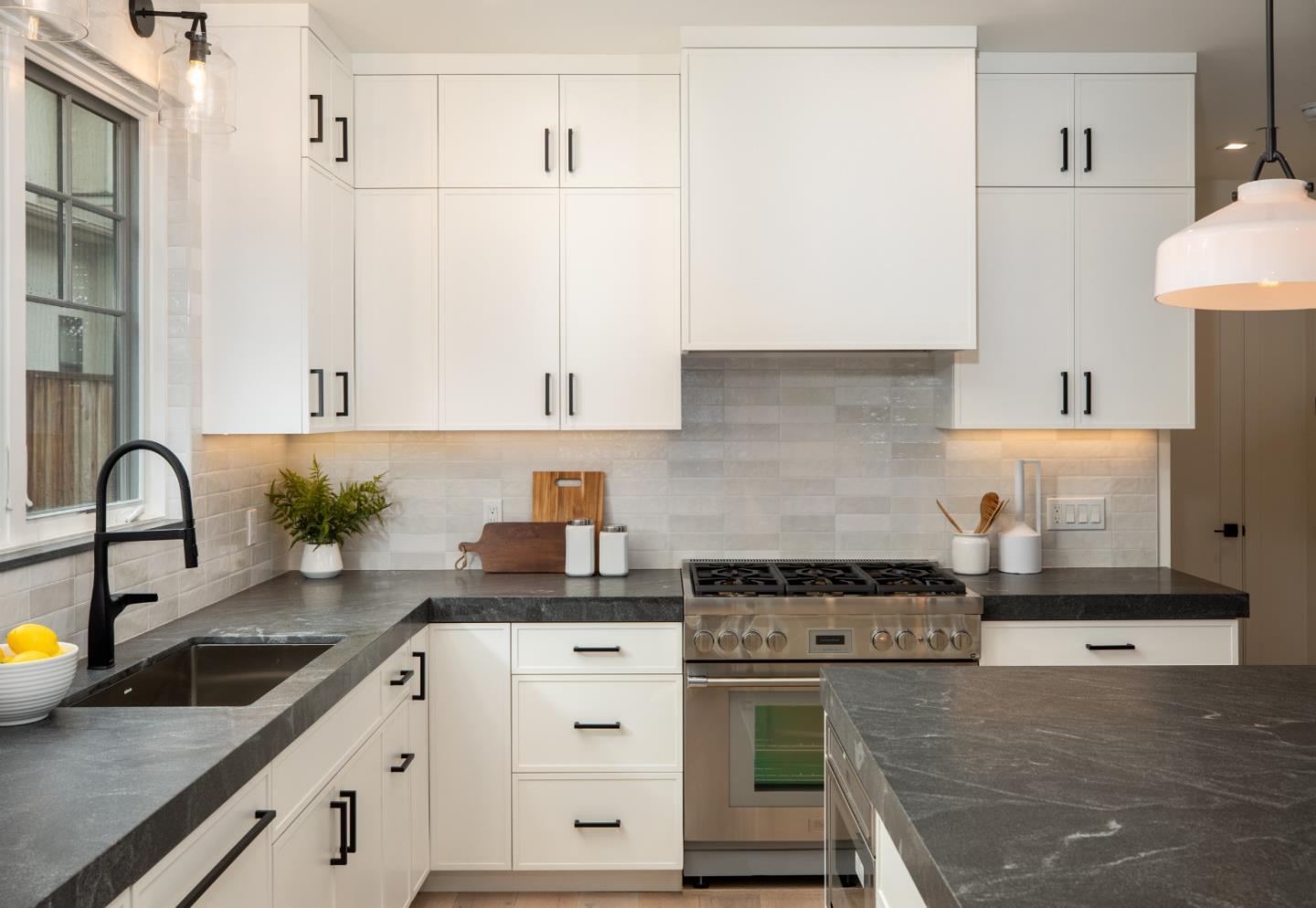 735-737 Linden Avenue Burlingame, CA 94010 - Photo 8 of 42 a kitchen with stainless steel appliances granite countertop a sink stove and cabinets