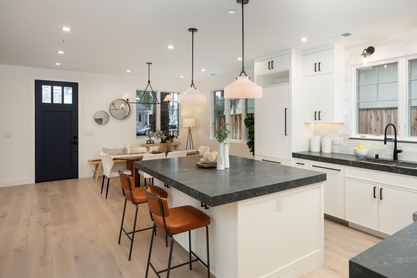 735-737 Linden Avenue Burlingame, CA 94010 - Photo 10 of 42 a kitchen with stainless steel appliances granite countertop a stove a sink a kitchen island with a kitchen island and chairs