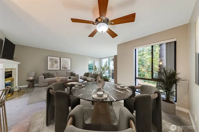 a living room with furniture chandelier and a large window