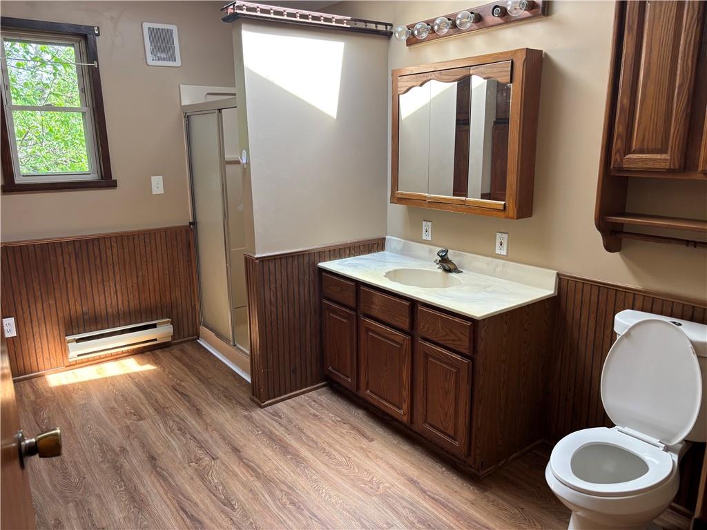 44 Bedford Road West Middlesex, PA 16159 - Photo 11 of 12 a bathroom with a toilet a sink and a mirror