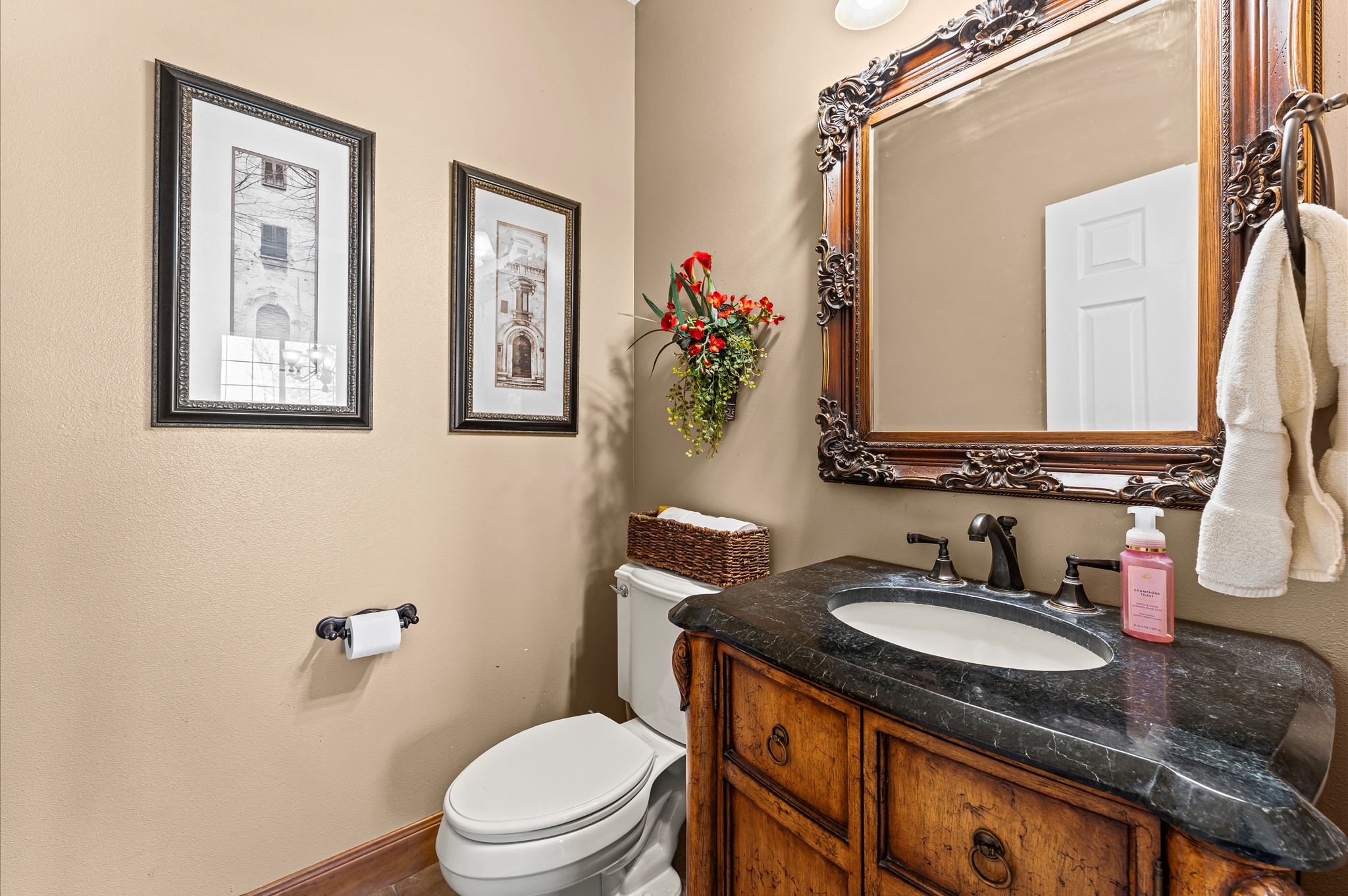 21550-21554 Mueschke Road Tomball, TX 77377 - Photo 11 of 42 a bathroom with a granite countertop toilet a sink and a mirror