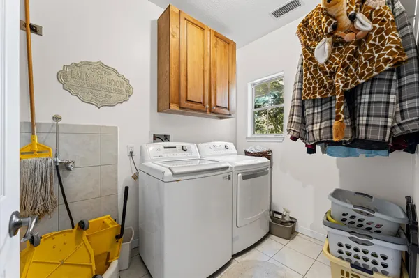 a utility room with dryer and washer