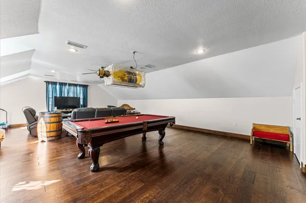 a room with furniture and wooden floor