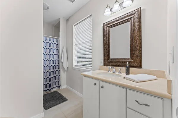 a bathroom with a sink a vanity and a mirror