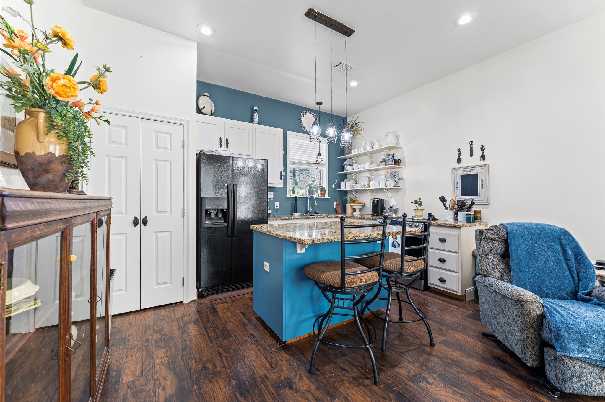 21550-21554 Mueschke Road Tomball, TX 77377 - Photo 28 of 42 a view of a dining room with furniture a chandelier and wooden floor