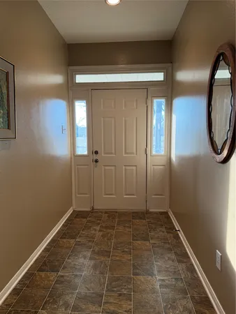 a view of a bathroom with brick walls
