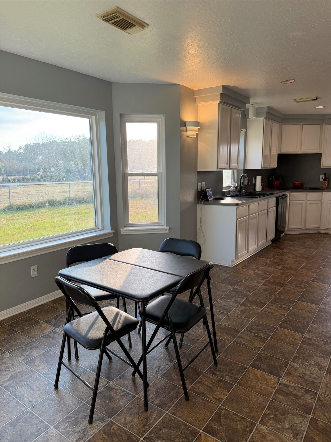 21550-21554 Mueschke Road Tomball, TX 77377 - Photo 36 of 42 a kitchen with a table chairs sink and cabinets